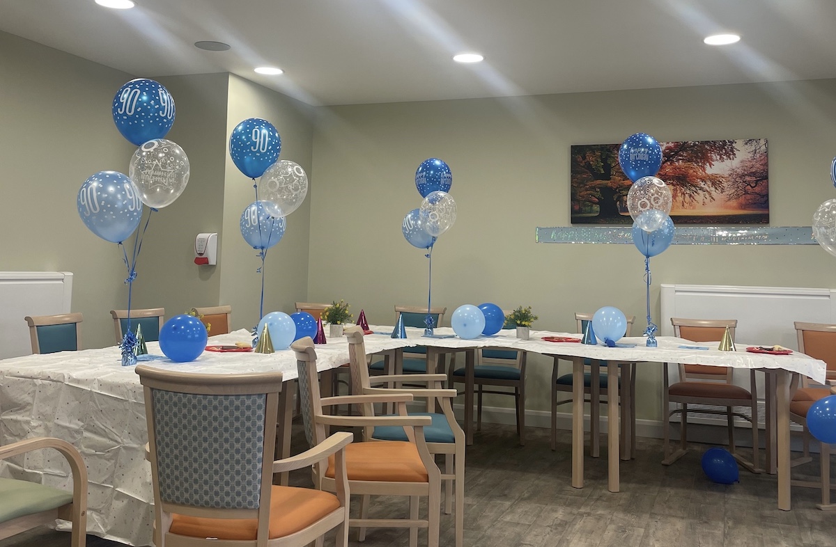 Birthday balloons on table at nursing home